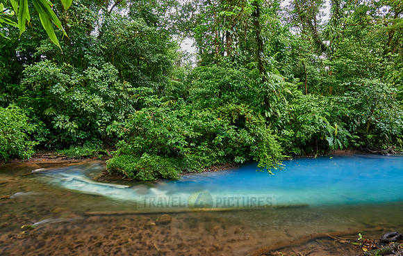 the confluence of two rivers the blue river Rio Celeste is formed