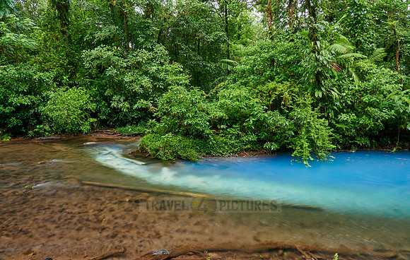 the confluence of two rivers the blue river Rio Celeste is formed
