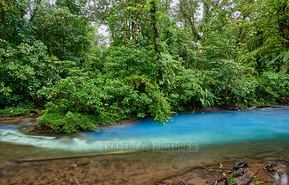the confluence of two rivers the blue river Rio Celeste is formed