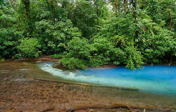 the confluence of two rivers the blue river Rio Celeste is formed