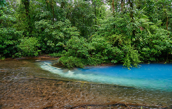 the confluence of two rivers the blue river Rio Celeste is formed