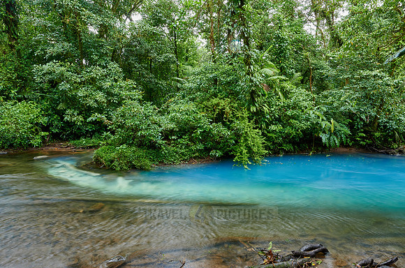 the confluence of two rivers the blue river Rio Celeste is formed