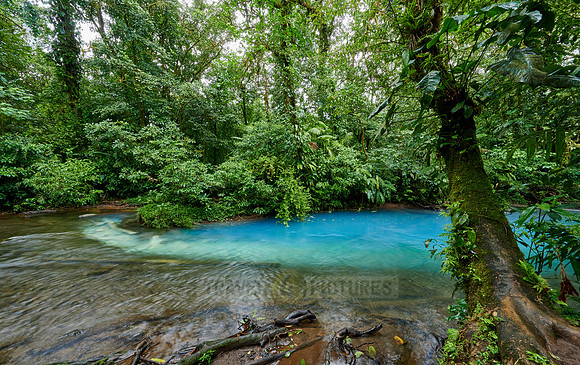 the confluence of two rivers the blue river Rio Celeste is formed