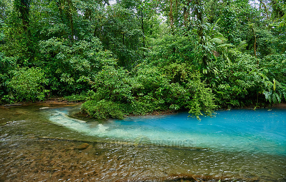 the confluence of two rivers the blue river Rio Celeste is formed
