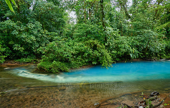the confluence of two rivers the blue river Rio Celeste is formed