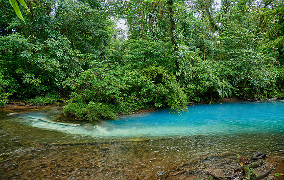 the confluence of two rivers the blue river Rio Celeste is formed