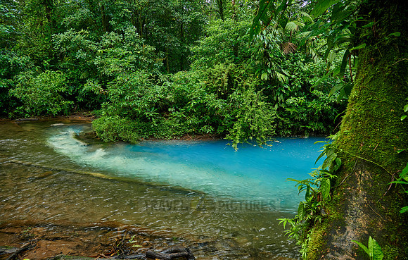 the confluence of two rivers the blue river Rio Celeste is formed