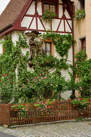 Facade of the castle hotel overgrown with plants