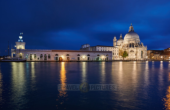 night shot of illuminated Basilica di Santa Maria della Salute with Punta della Dogana