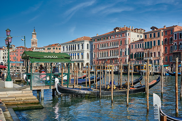 gondolas in front of typical Venetian house facades on the Grand Canal