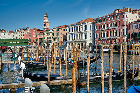 gondolas in front of typical Venetian house facades on the Grand Canal