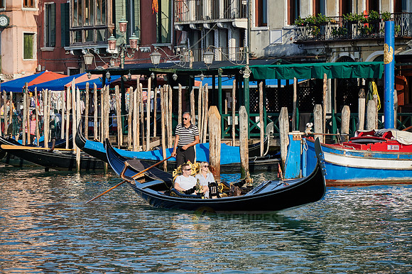 gondolas in front of typical Venetian house facades on the Grand Canal