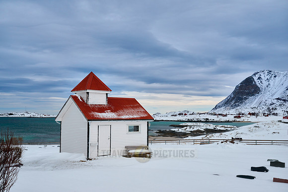 Cemetery with chapel in the snow of Vestersand