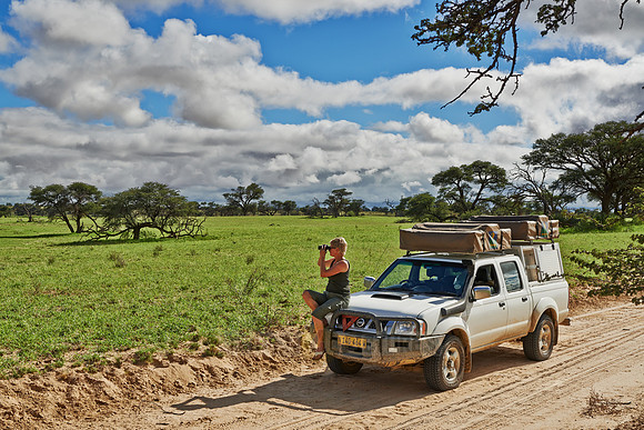 woman on 4x4 watching aera in landscape