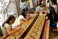 women stitching tapestries