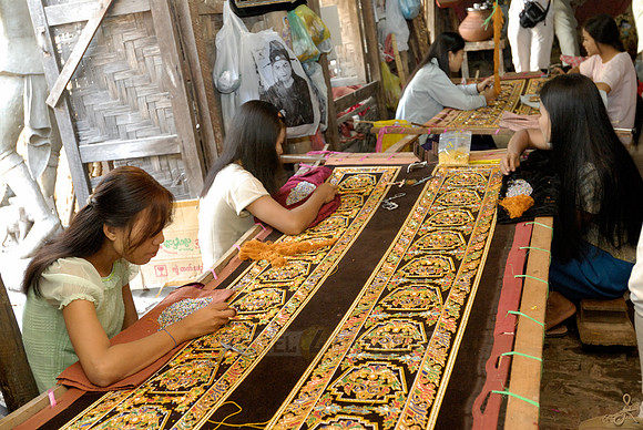 women stitching tapestries