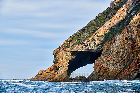 cliffs and cave at coastline