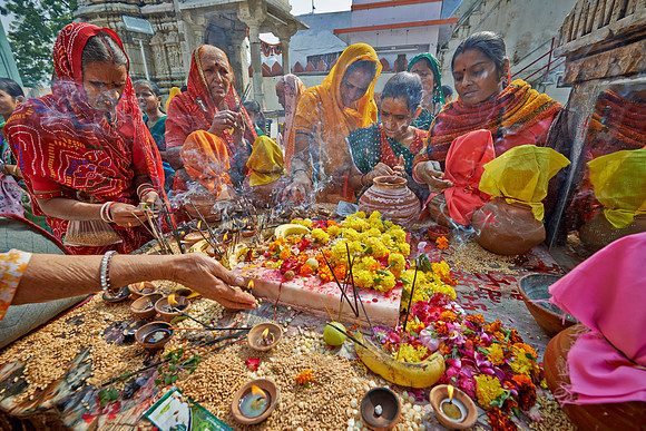 colorful hindu women during ceremony