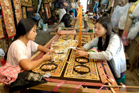 women stitching tapestries