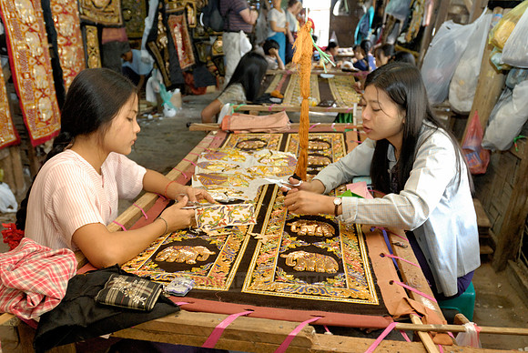 women stitching tapestries