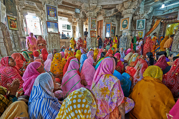 colorful hindu women during ceremony