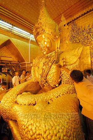 uddha with thick layer of golden leaves in Mahamuni Pagoda