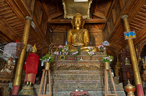 main golden Buddha statue inside Shwe Yaungwe monastery
