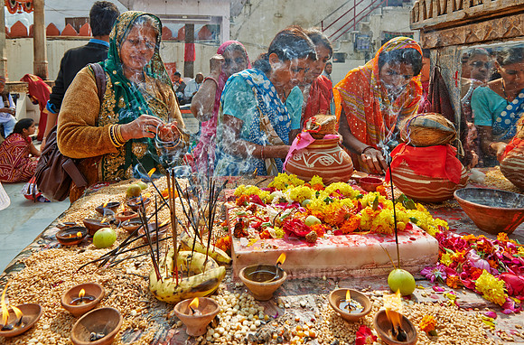 colorful hindu women during ceremony