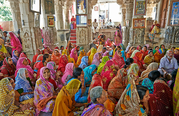 colorful hindu women during ceremony