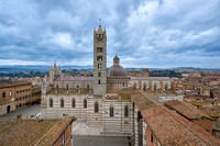 view over roofs of Siena to Cathedral of Siena