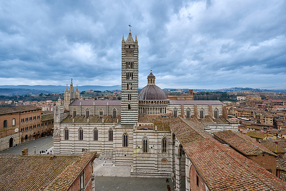 view over roofs of Siena to Cathedral of Siena