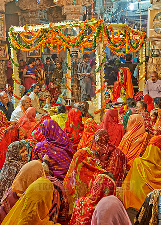 colorful hindu women during ceremony