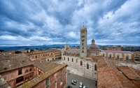 view over roofs of Siena to Cathedral of Siena