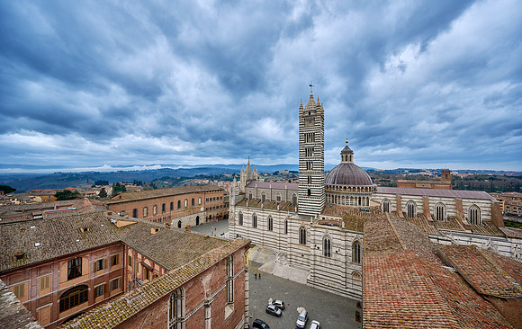 view over roofs of Siena to Cathedral of Siena