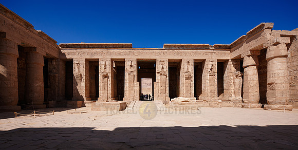 Columns of god Osiris at western colonade in second yard