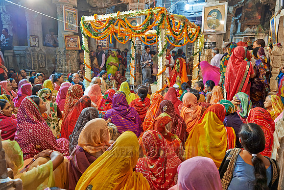 colorful hindu women during ceremony