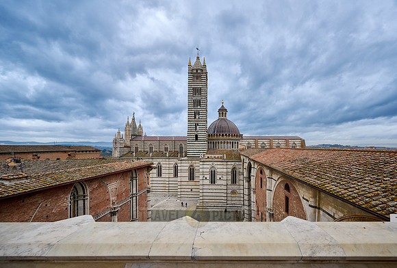 view over roofs of Siena to Cathedral of Siena