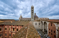 view over roofs of Siena to Cathedral of Siena