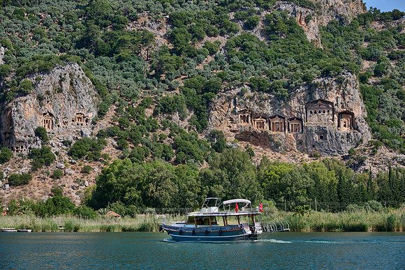 Tourist ship in front of Lycian rock tombs