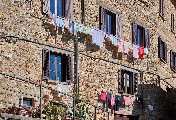 Laundry hangs to dry on Volterra windows