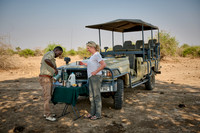 tourist and guide at tea time on Safari
