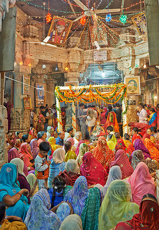 colorful hindu women during ceremony