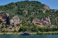 Tourist ship in front of Lycian rock tombs