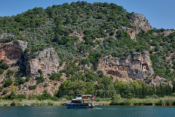 Tourist ship in front of Lycian rock tombs