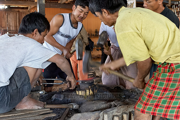 blacksmith beating iron