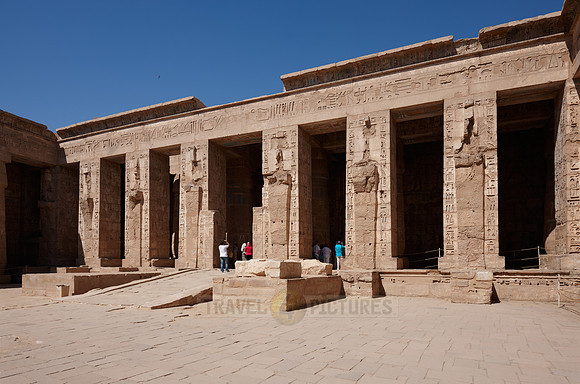 Columns of god Osiris at western colonade in second yard