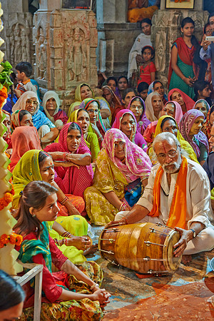 colorful hindu women during ceremony