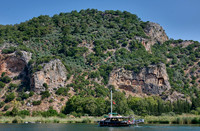 Tourist ship in front of Lycian rock tombs