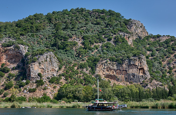 Tourist ship in front of Lycian rock tombs