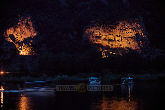 night shot of illuminated Lycian rock tombs in a rock face of Dalyan